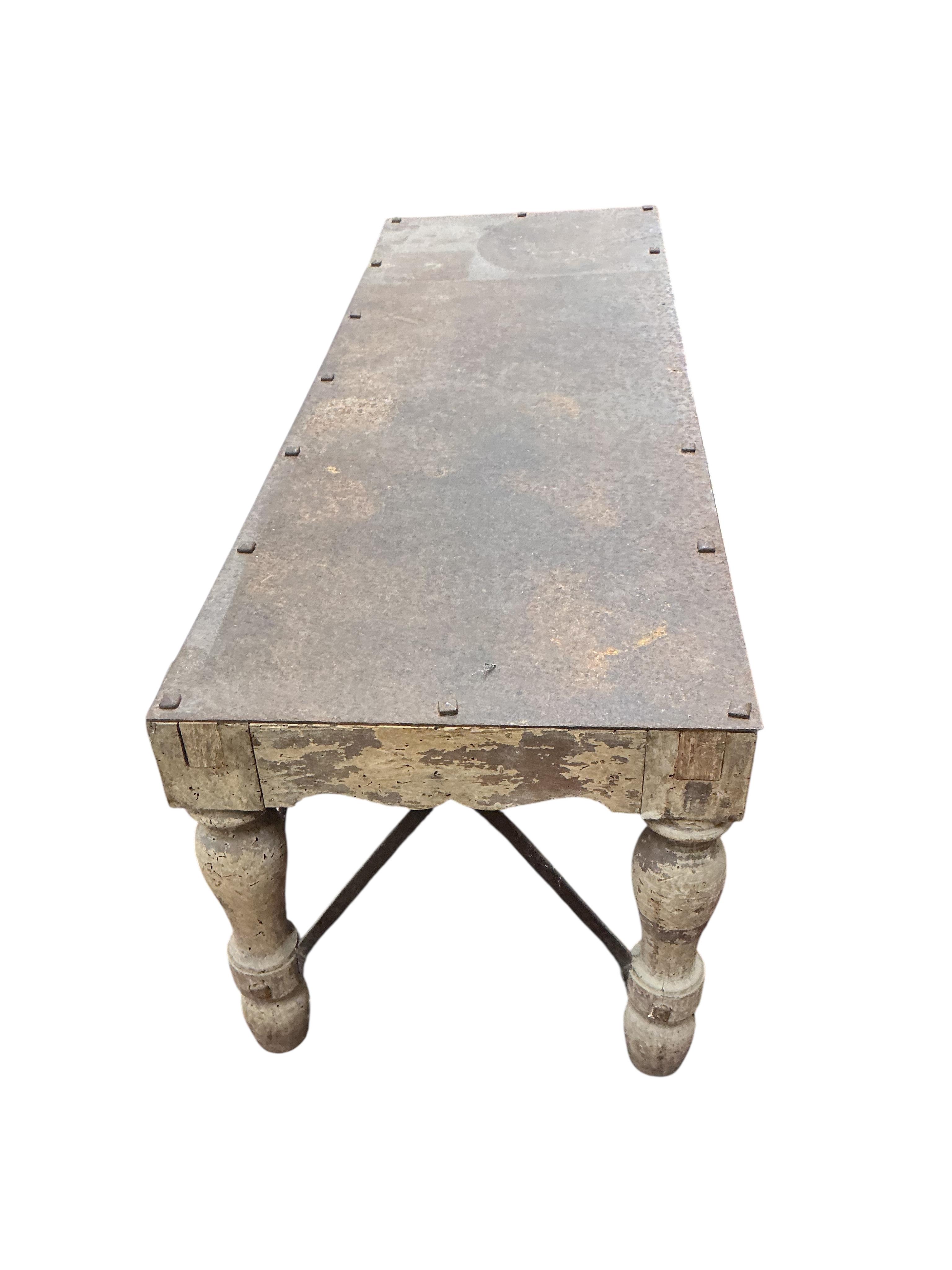 A rectangular bleached wood coffee table with studded iron top, width 130cm, depth 46cm, height 46cm